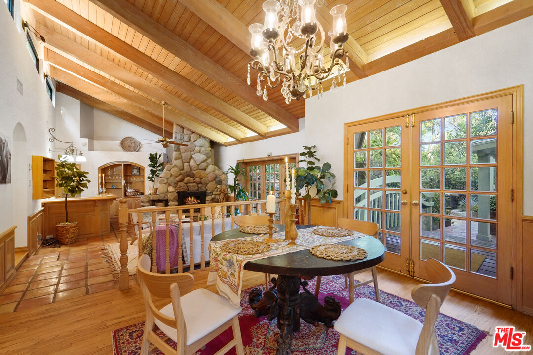 a view of a dining room with furniture wooden floor and chandelier