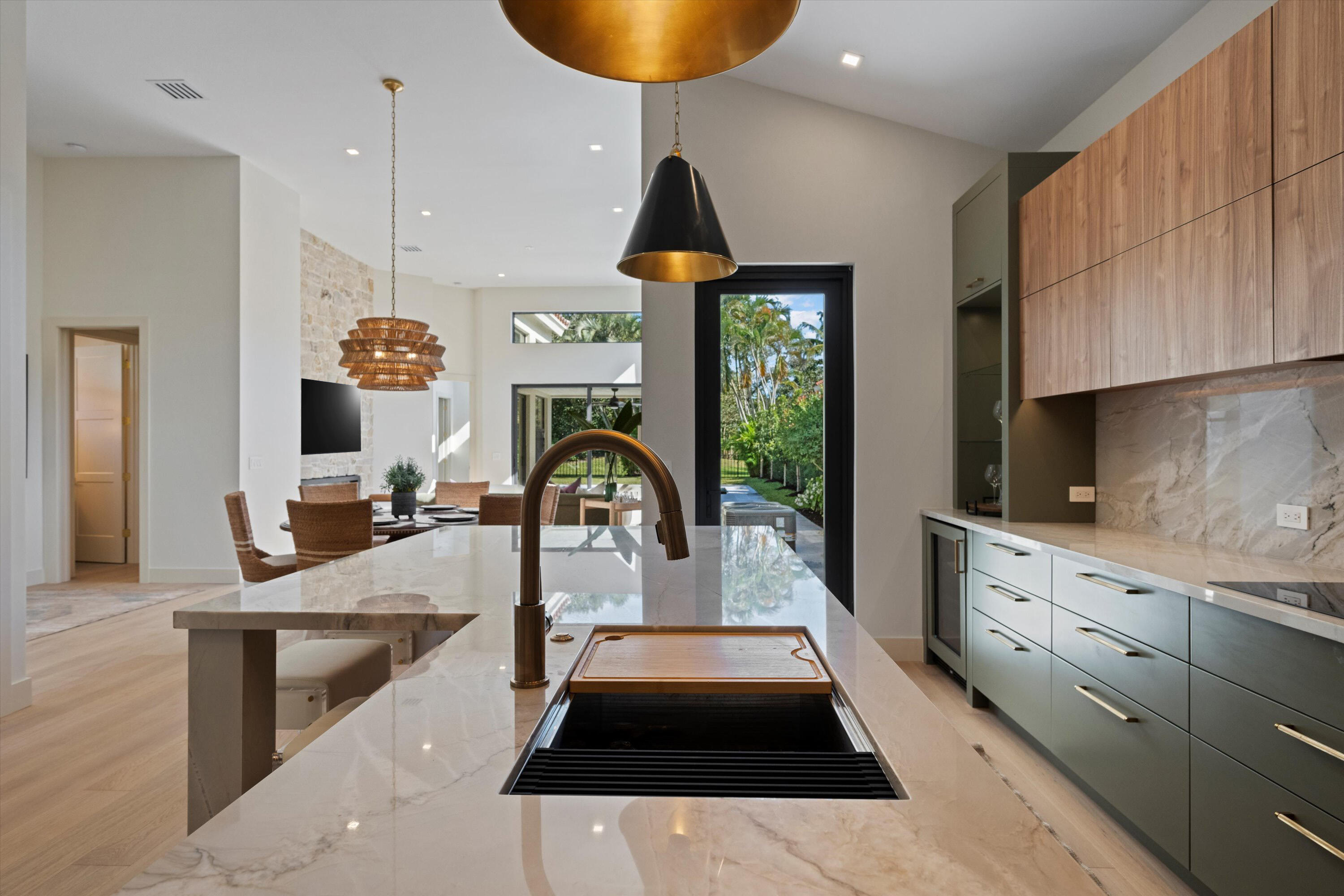 a kitchen with sink and cabinets