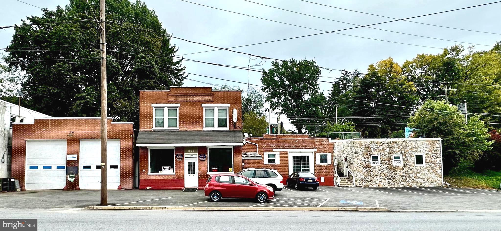 a front view of a building with garden