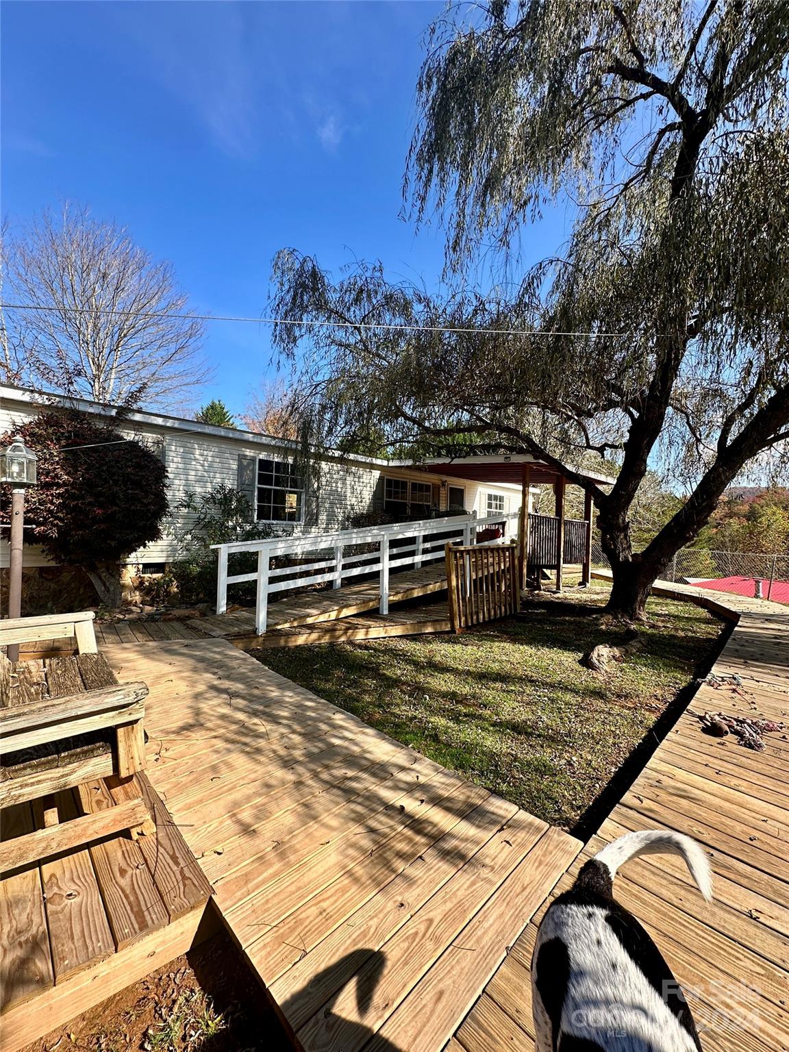 a view of a backyard with sitting area