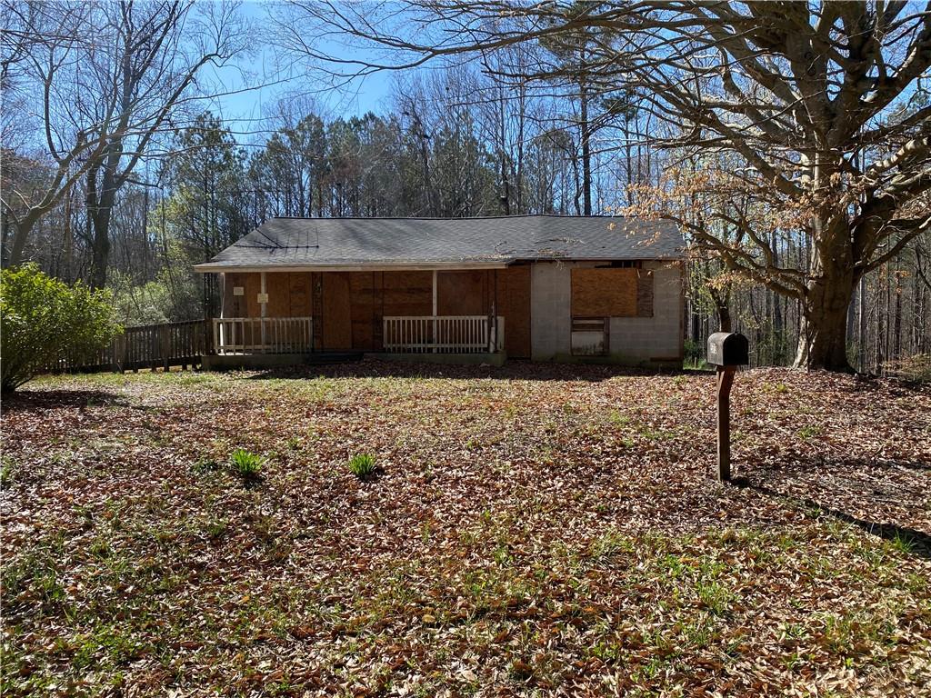 a front view of house with yard and trees