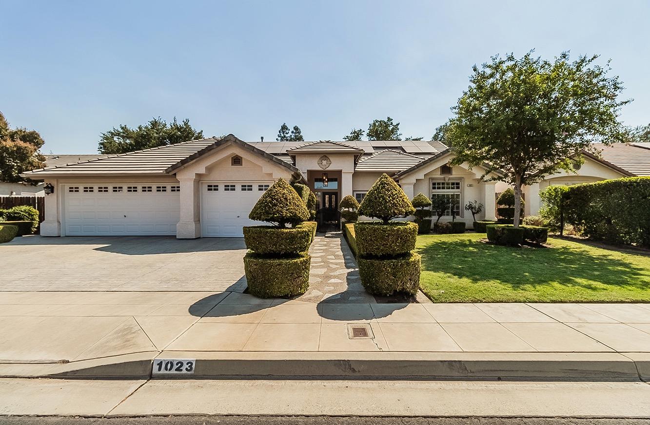 a house view with a garden space