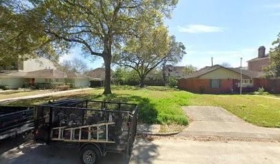 a view of backyard with wooden fence