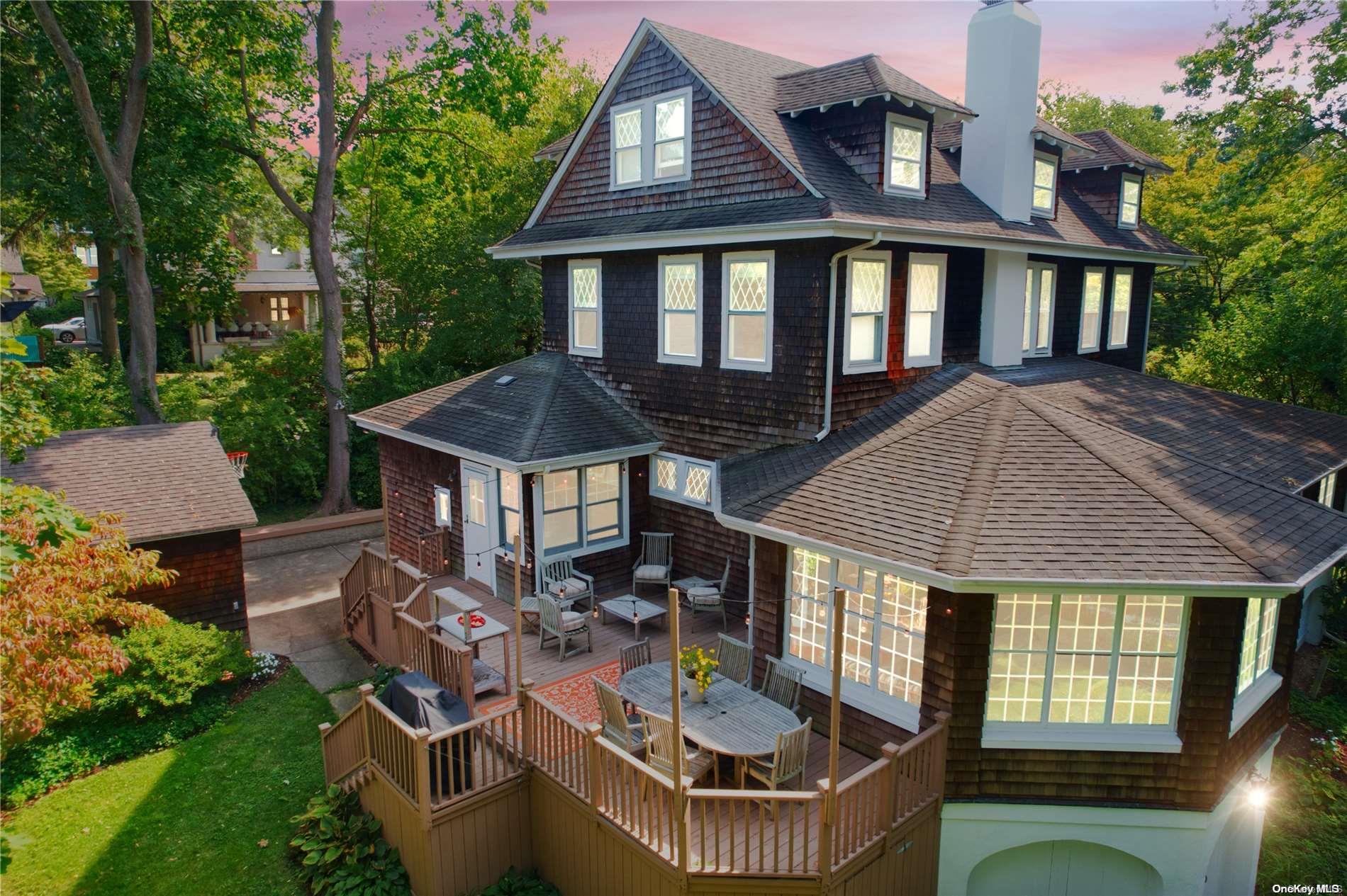 a front view of a house with yard outdoor seating and barbeque oven