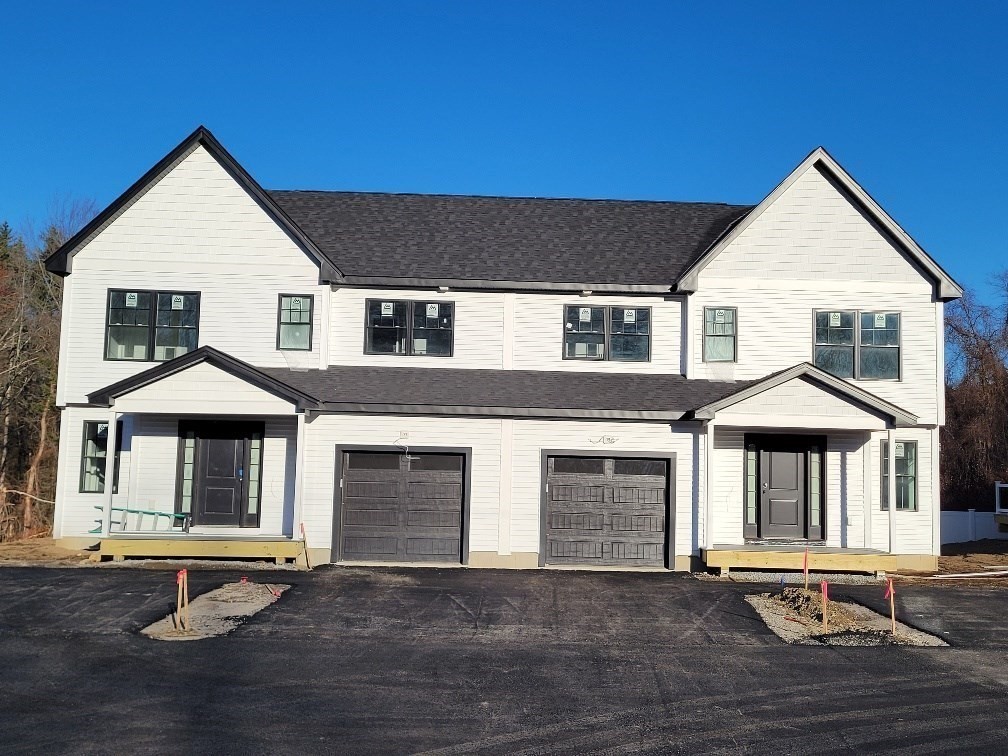 a front view of a house with yard