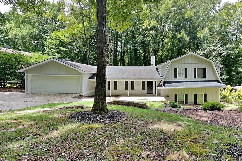 a house that has tree in front of it