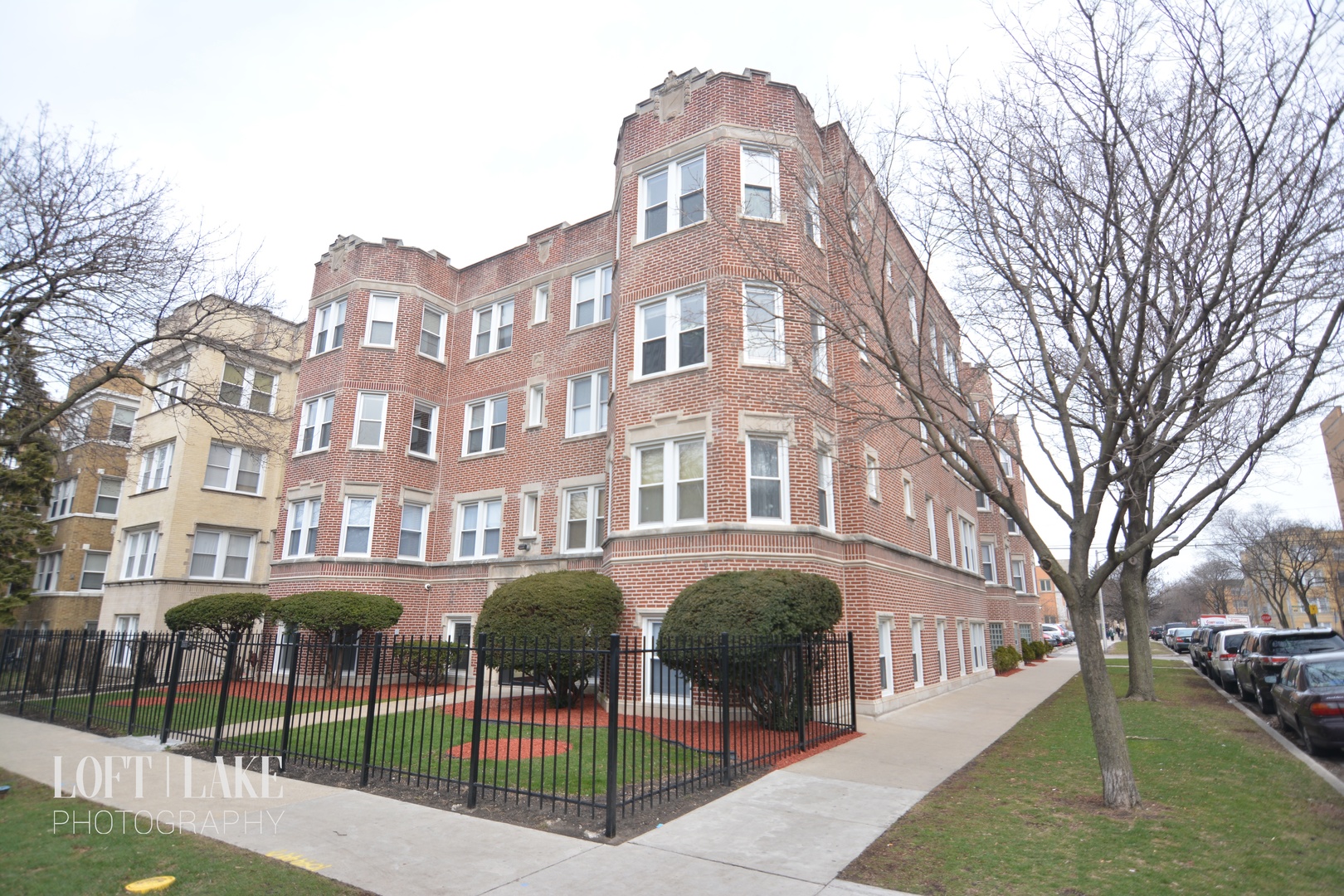 a front view of a building with garden