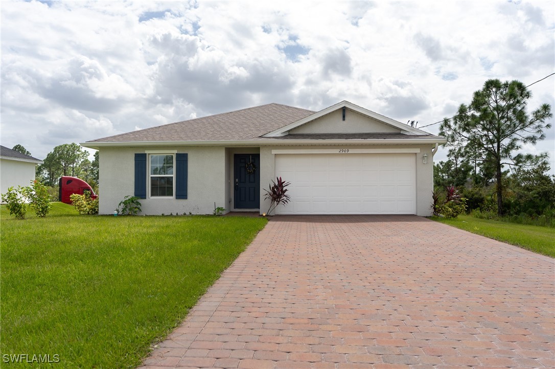 a front view of house with yard and green space