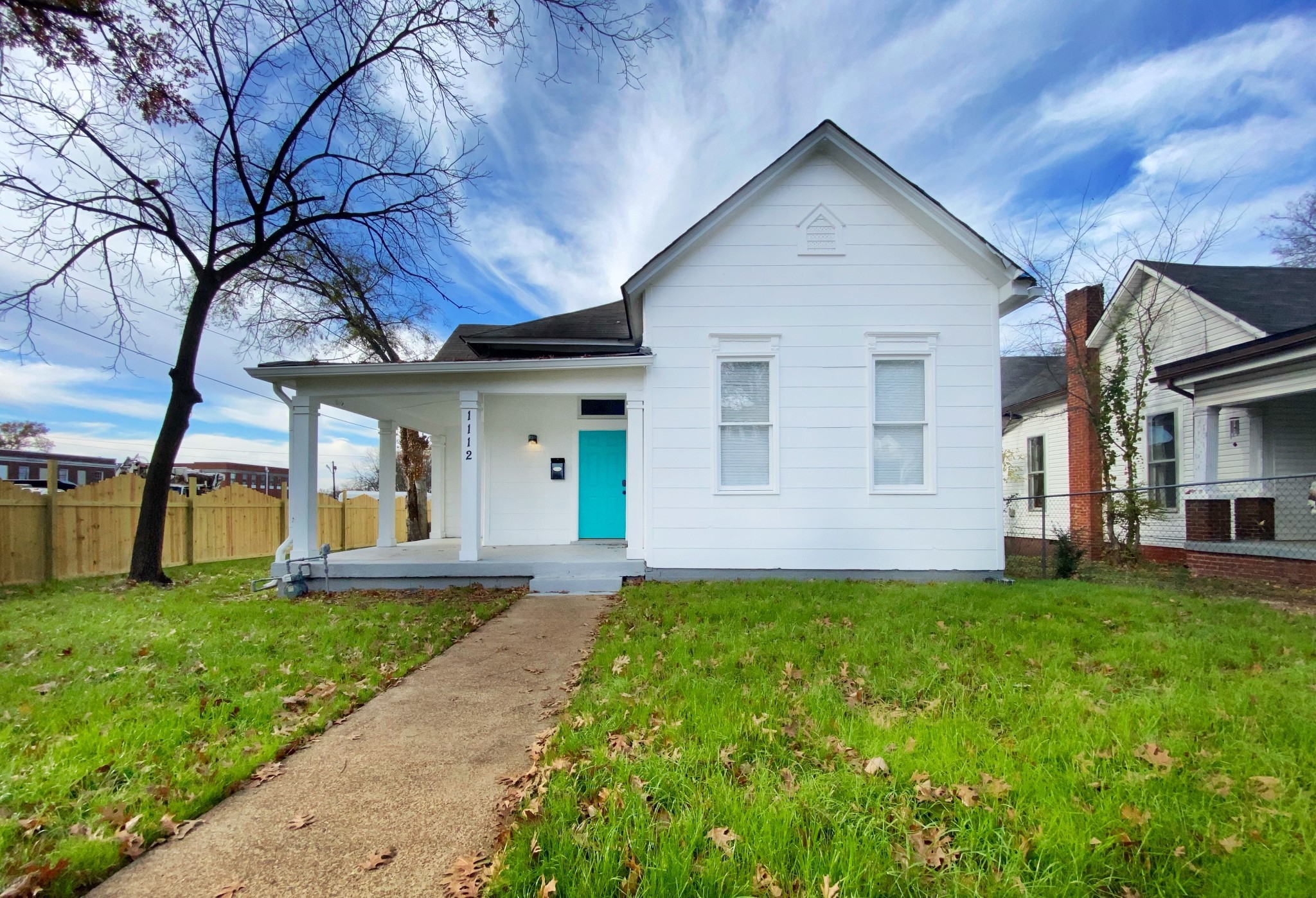 a view of a yard in front of a house