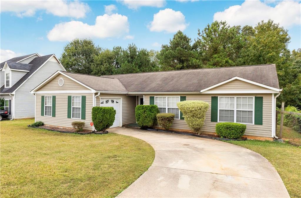 a front view of a house with a yard and porch