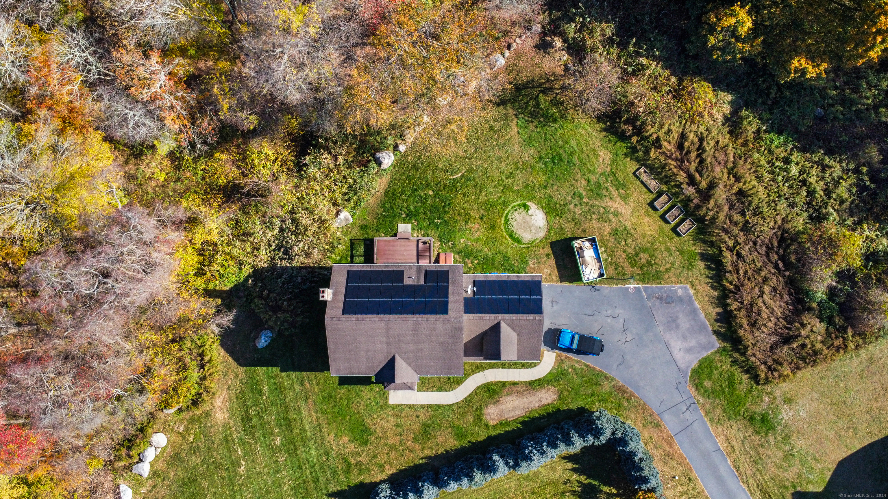 a view of a house with swimming pool in front of it