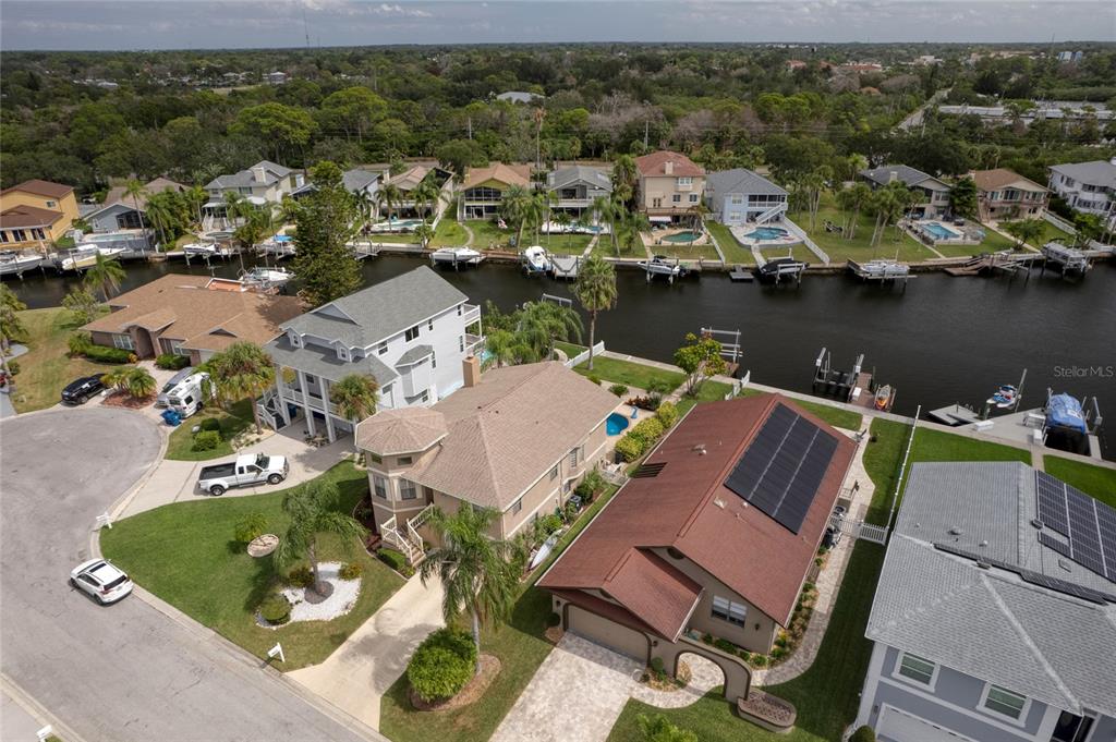 an aerial view of a house with a lake view