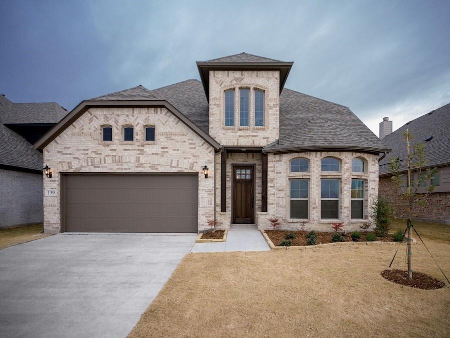 a front view of a house with yard