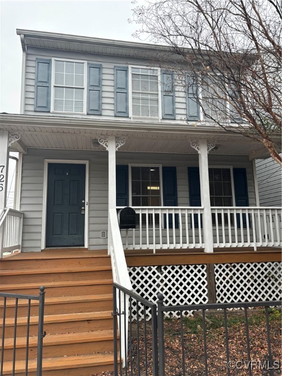 View of front of property featuring covered porch