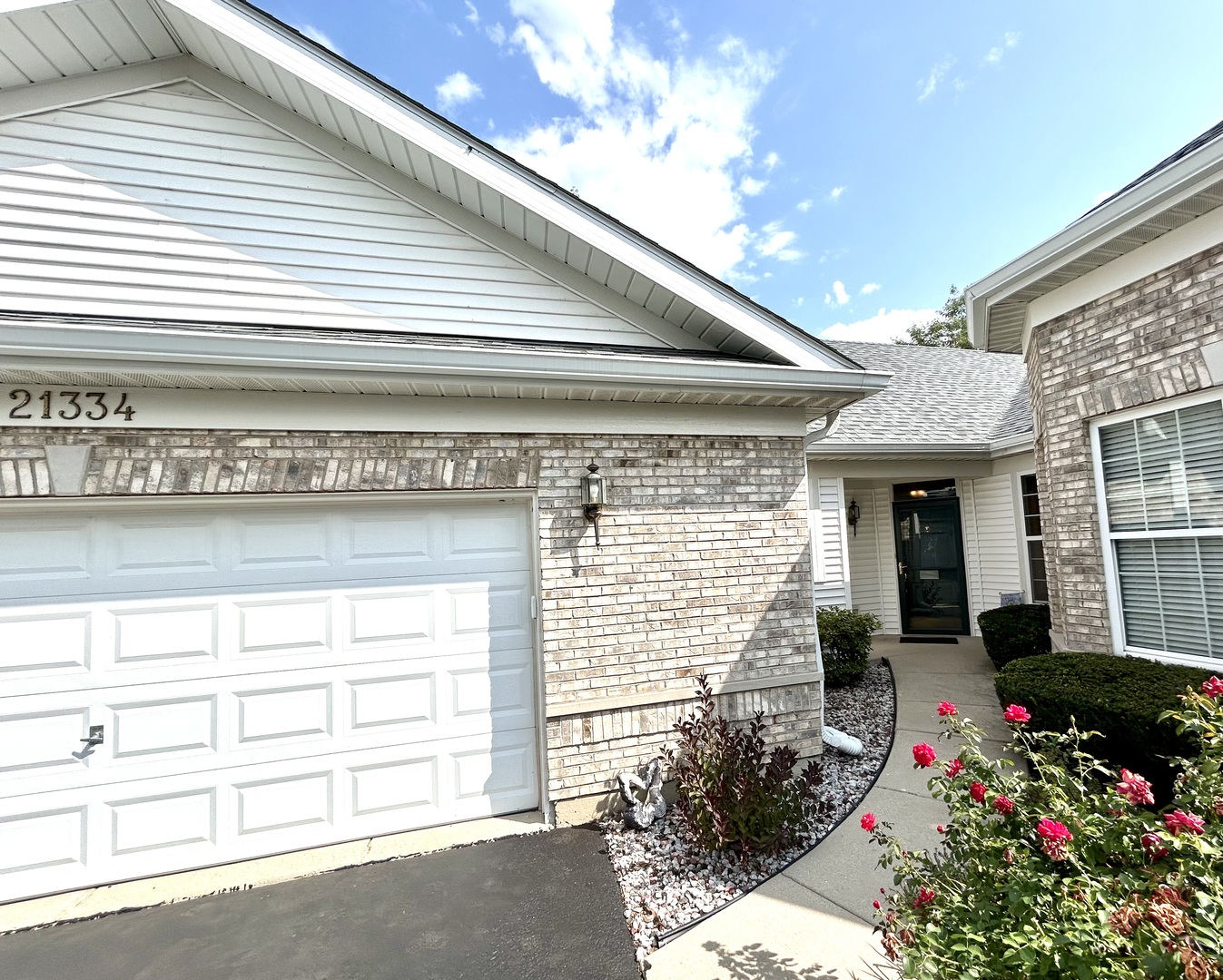 a front view of a house with a garage