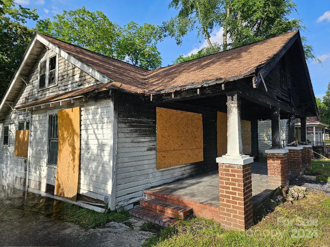 a view of a house with wooden walls