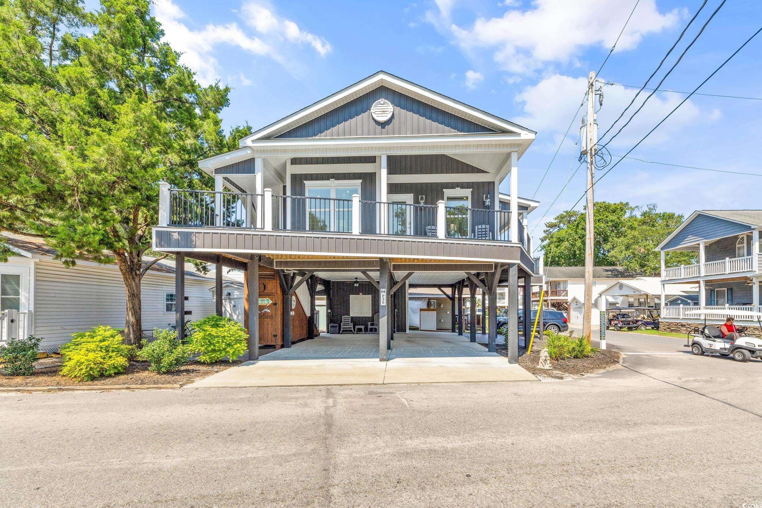 Coastal home featuring a carport