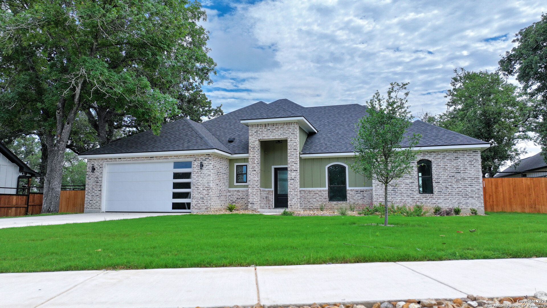 front view of a house with a yard