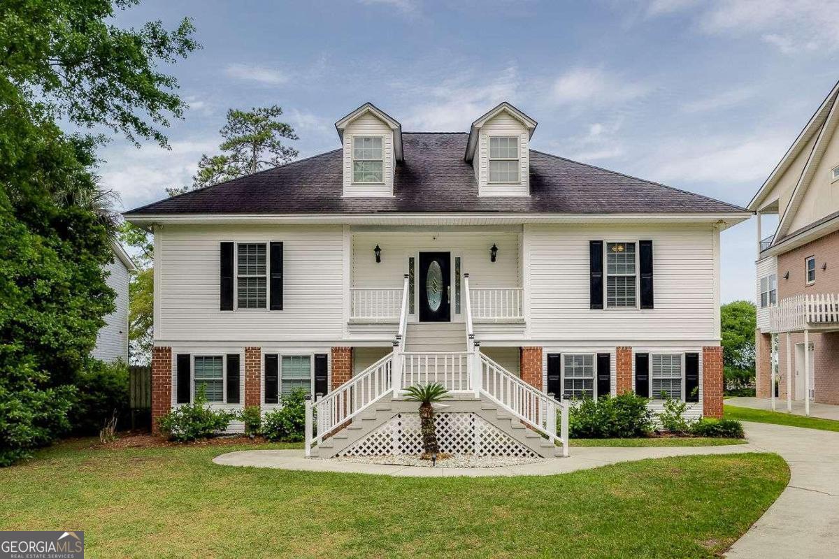 a front view of a house with a yard