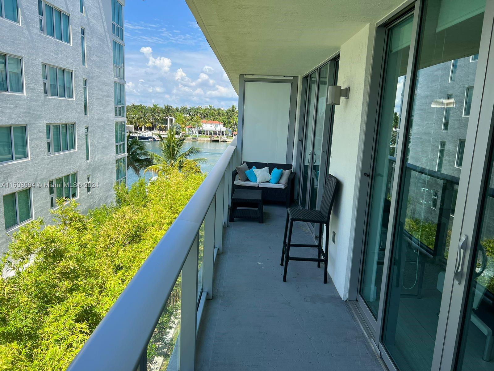 a couple of table and chairs in the balcony