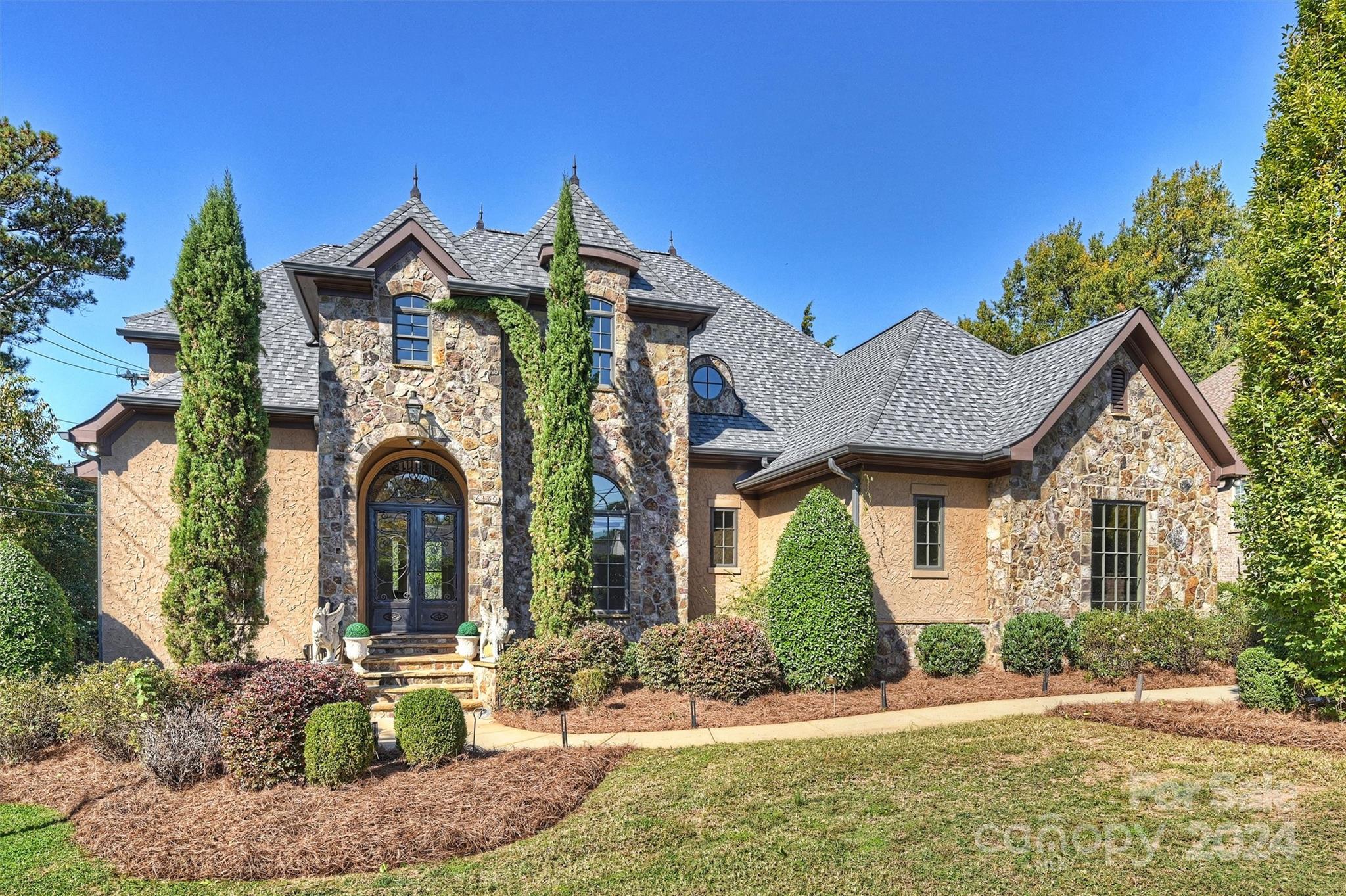 a front view of a house with garden