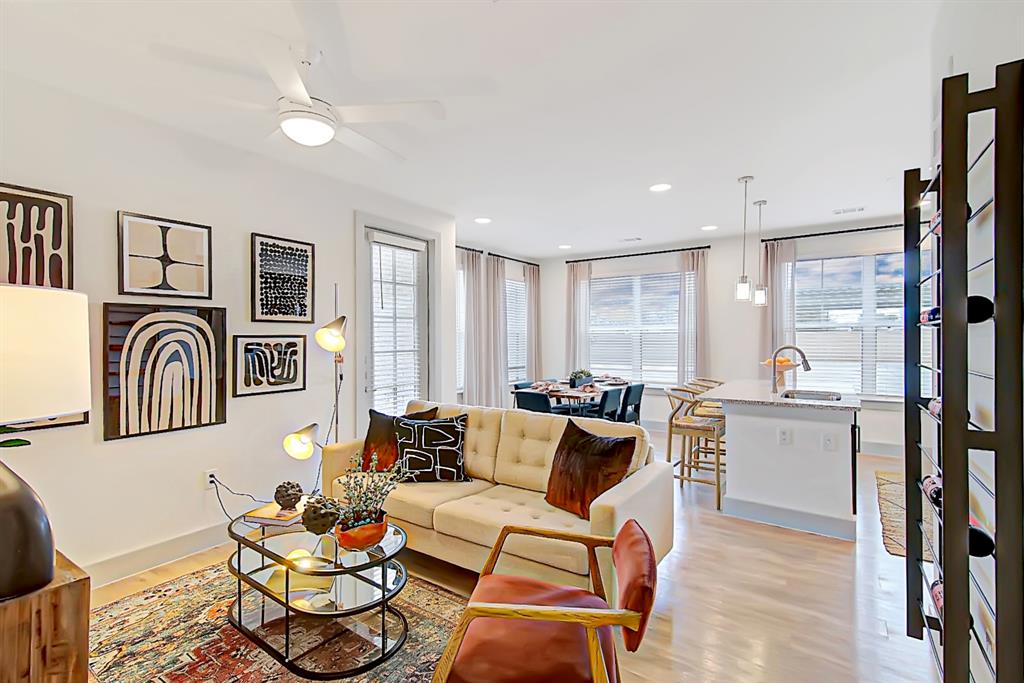 a living room with fireplace furniture and a table