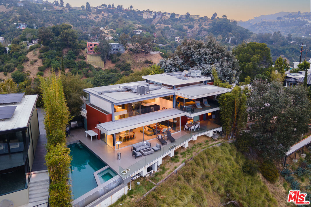 an aerial view of a house with a big yard