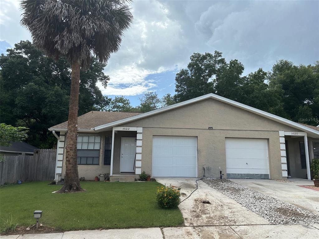 front view of a house with a yard