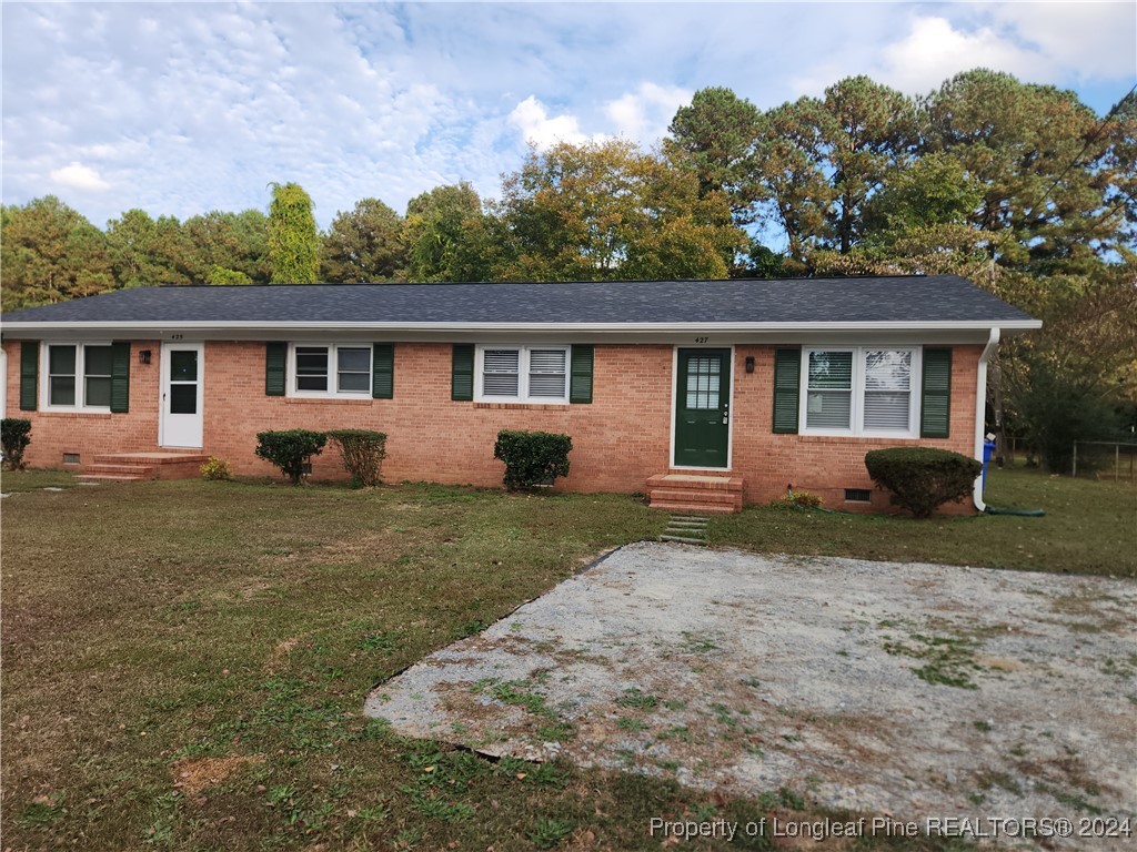 front view of a house with a yard