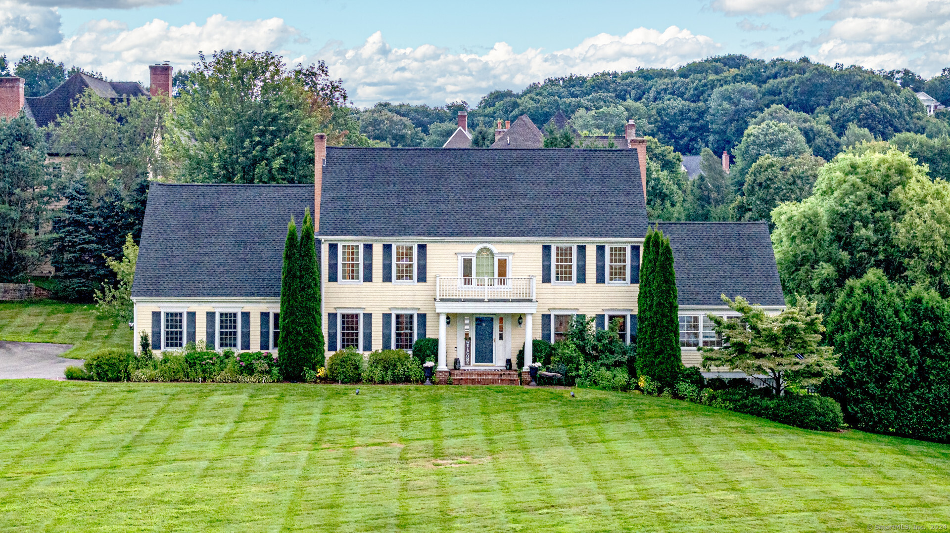 a front view of a house with garden