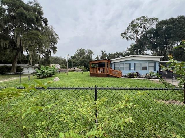 a view of house with outdoor space and garden