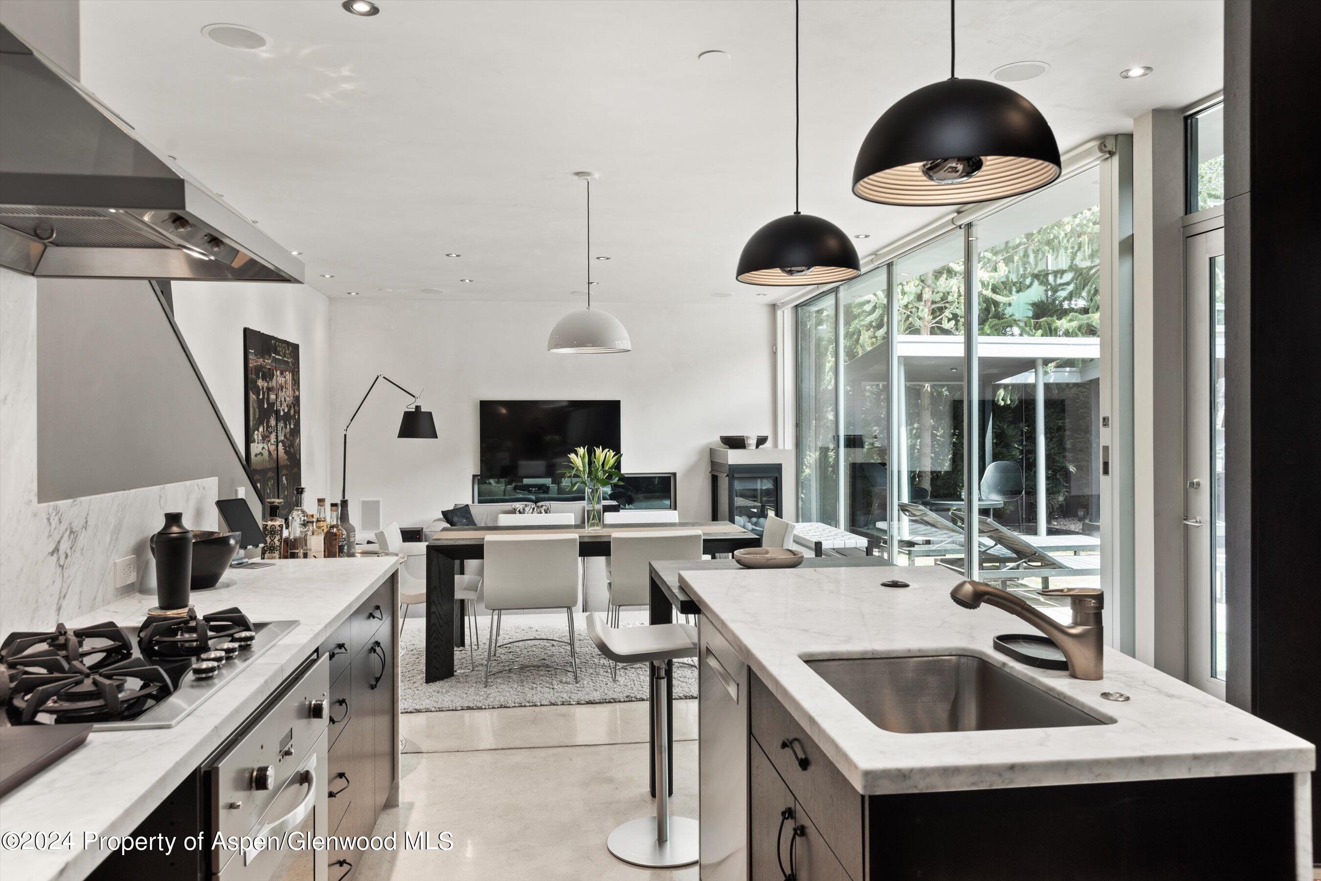 a kitchen with a sink stove and cabinets