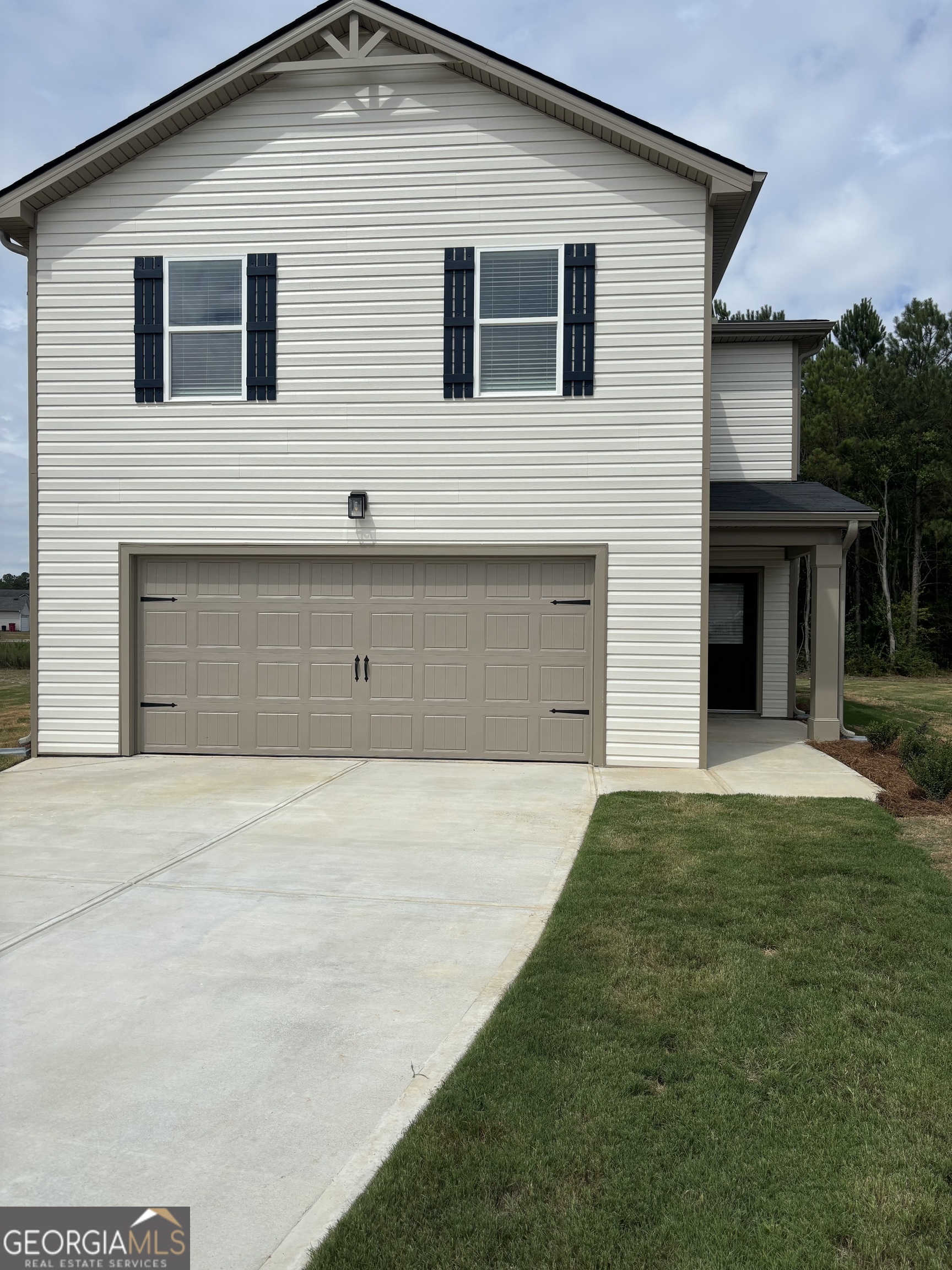 a front view of a house with a yard