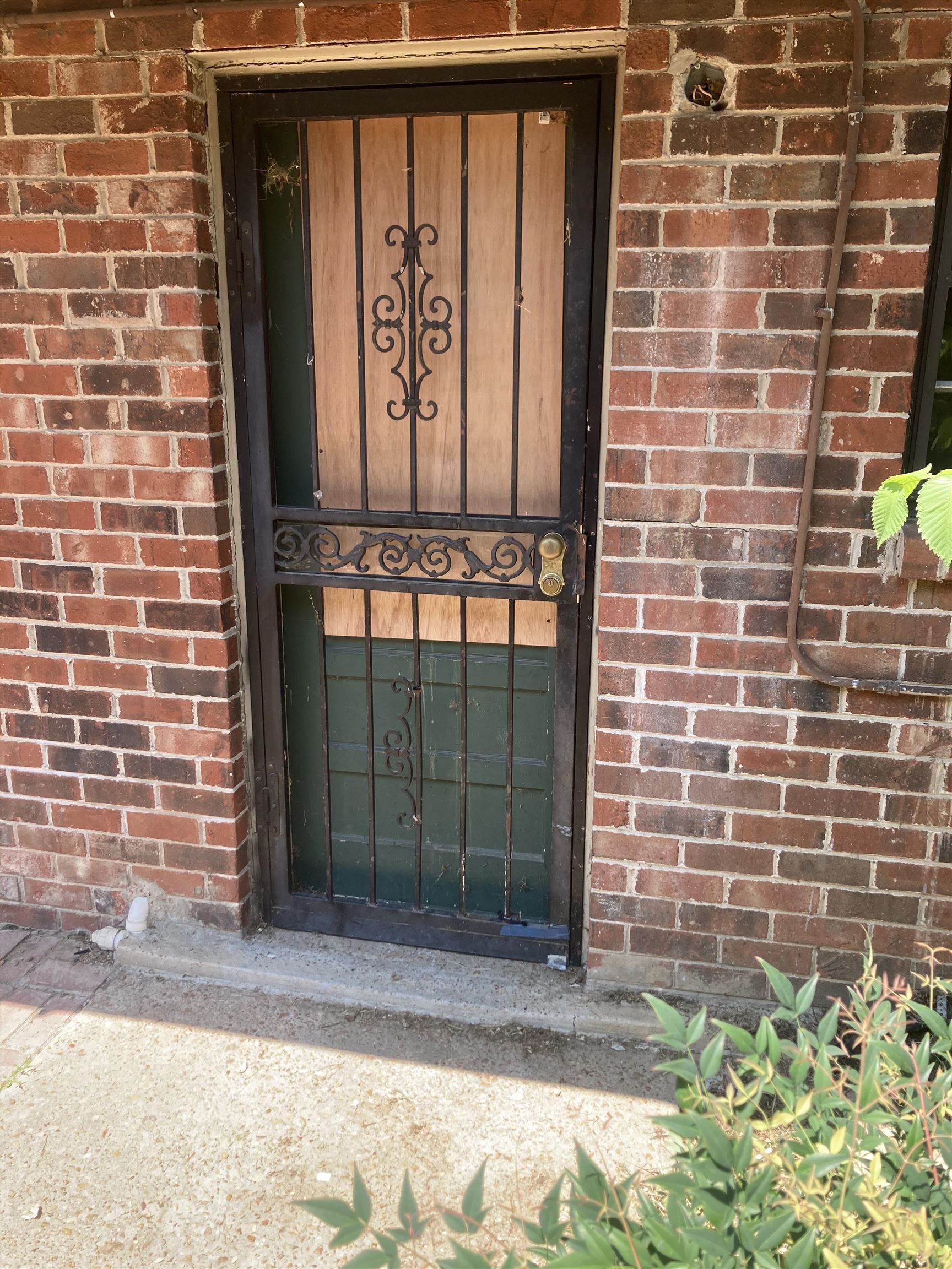 a brick building with a sign on it