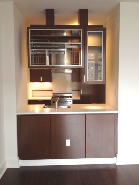 a kitchen with a sink and cabinets