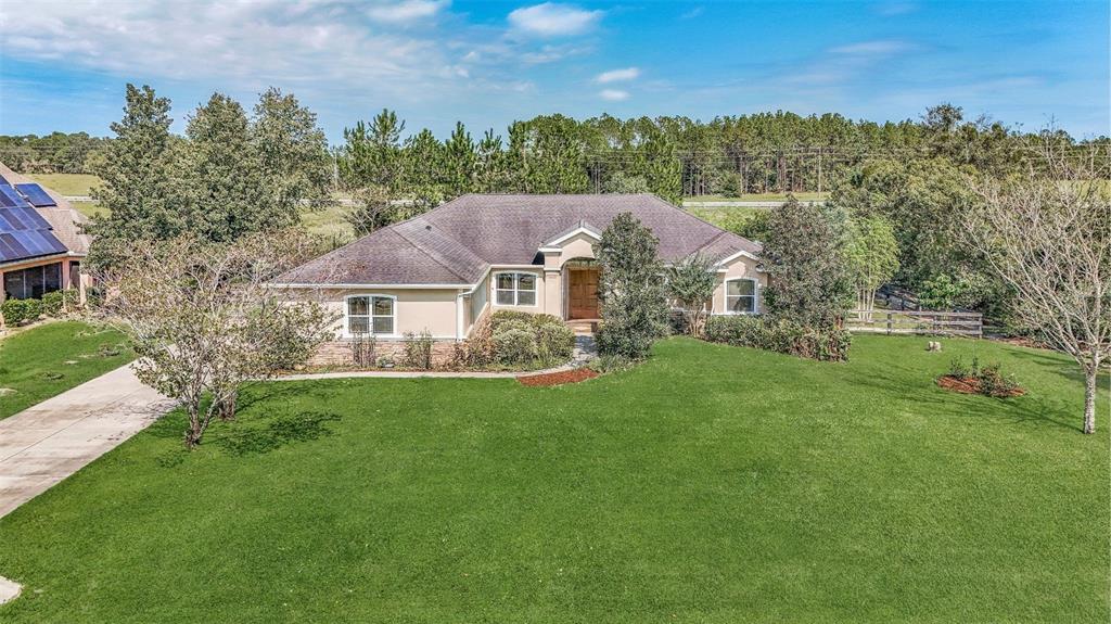 a aerial view of a house with a yard