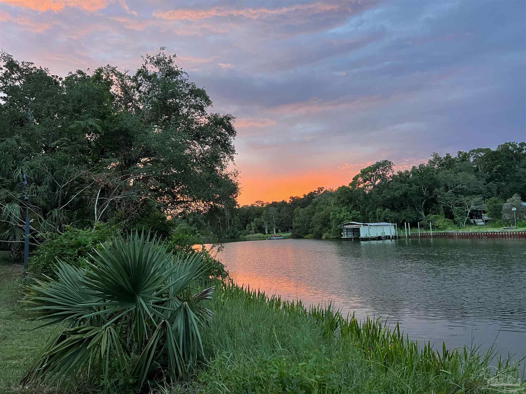 a view of a lake with a garden