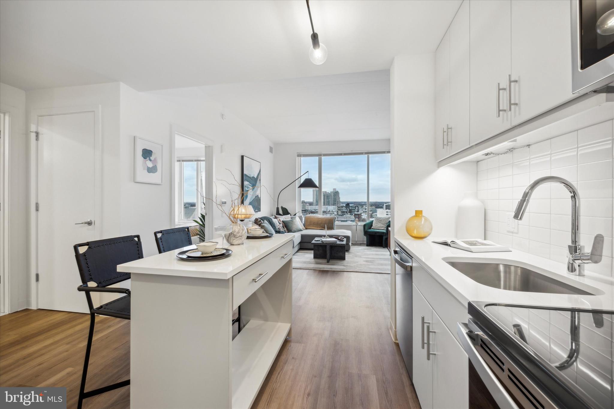 a kitchen with a sink stove and cabinets