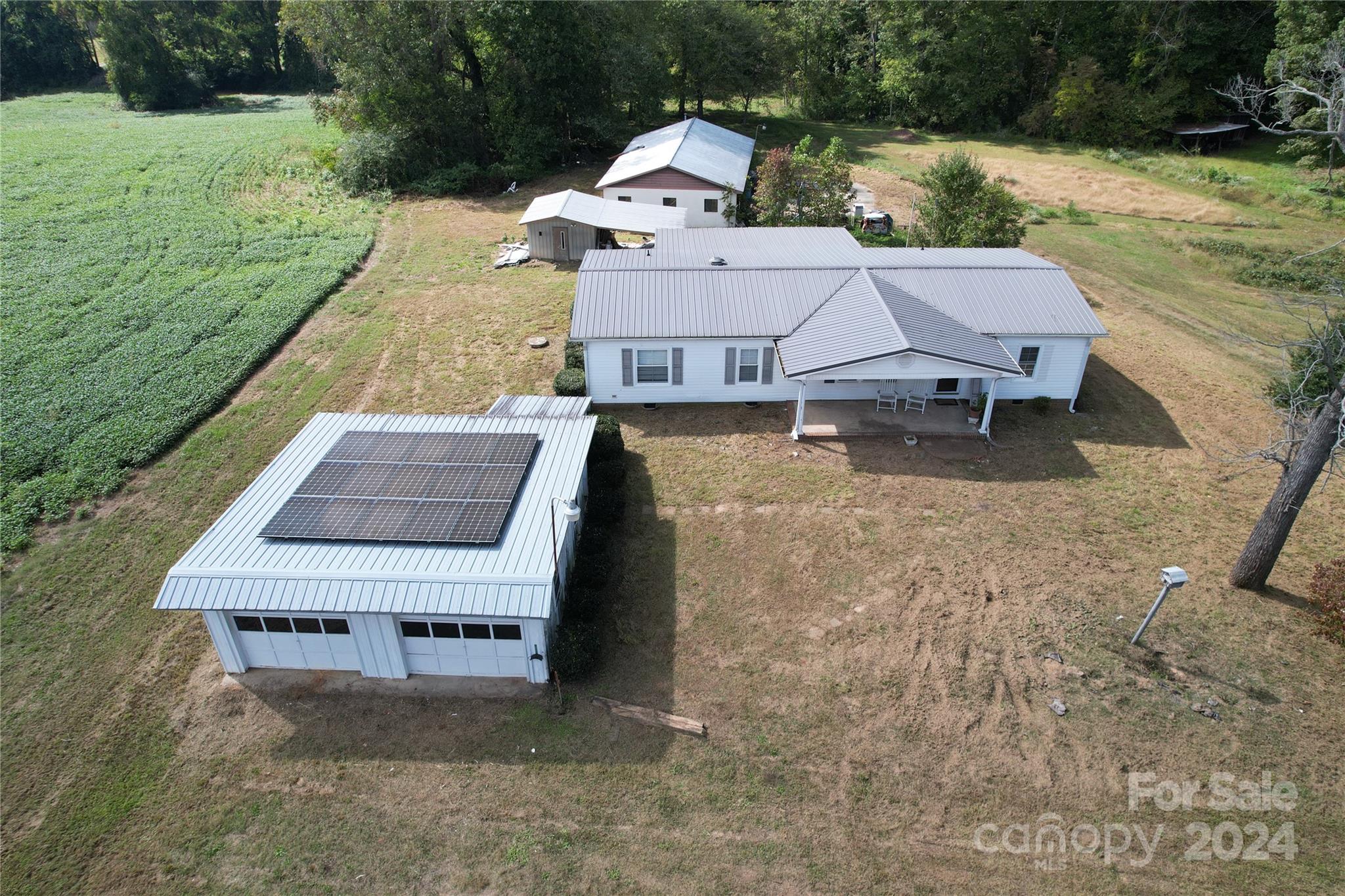 a aerial view of a house with a yard