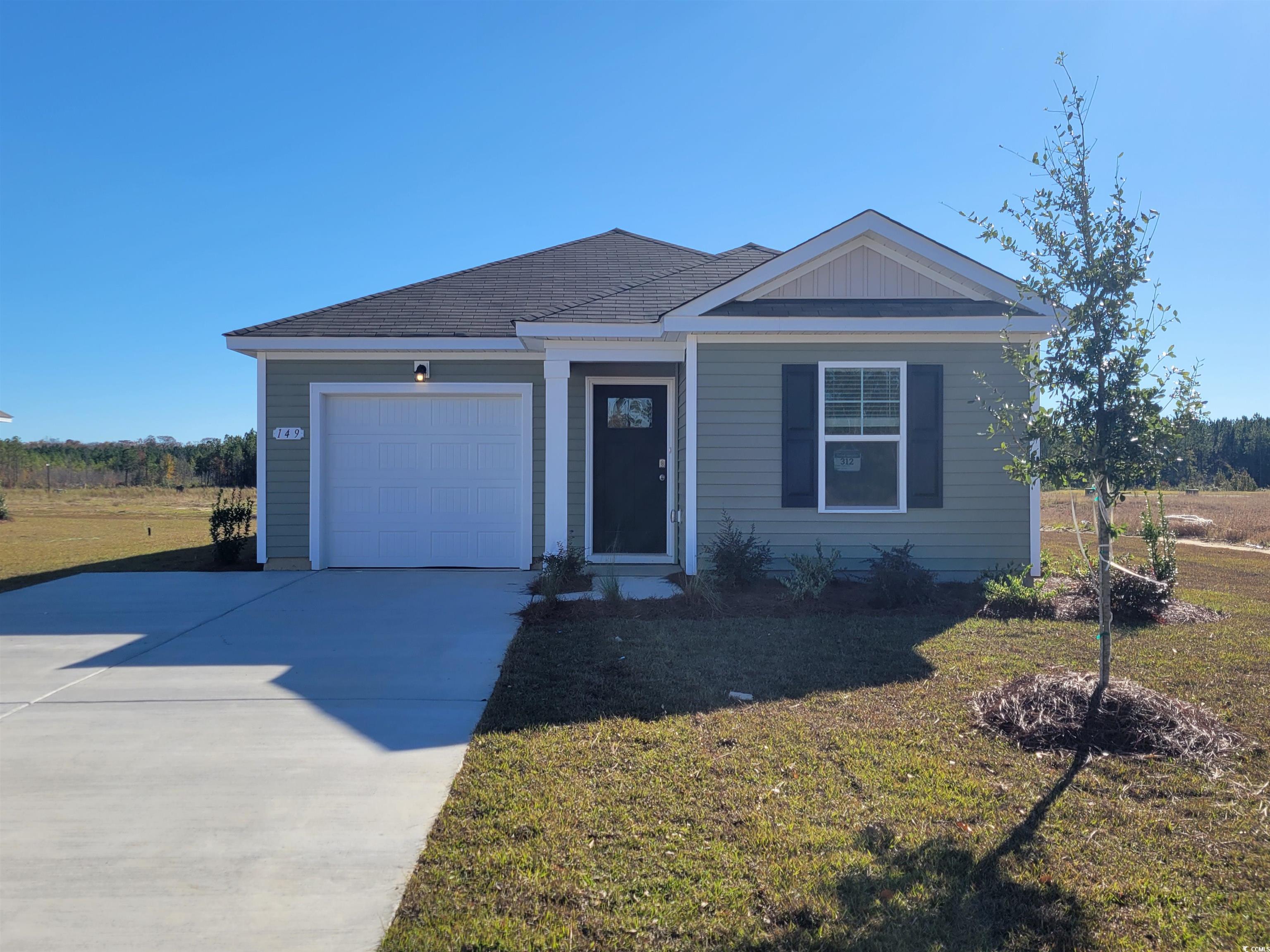 View of front of property with a garage and a fron