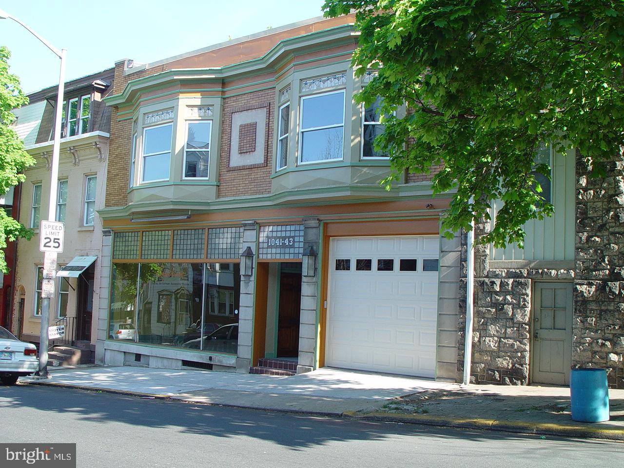 a front view of a building with street view