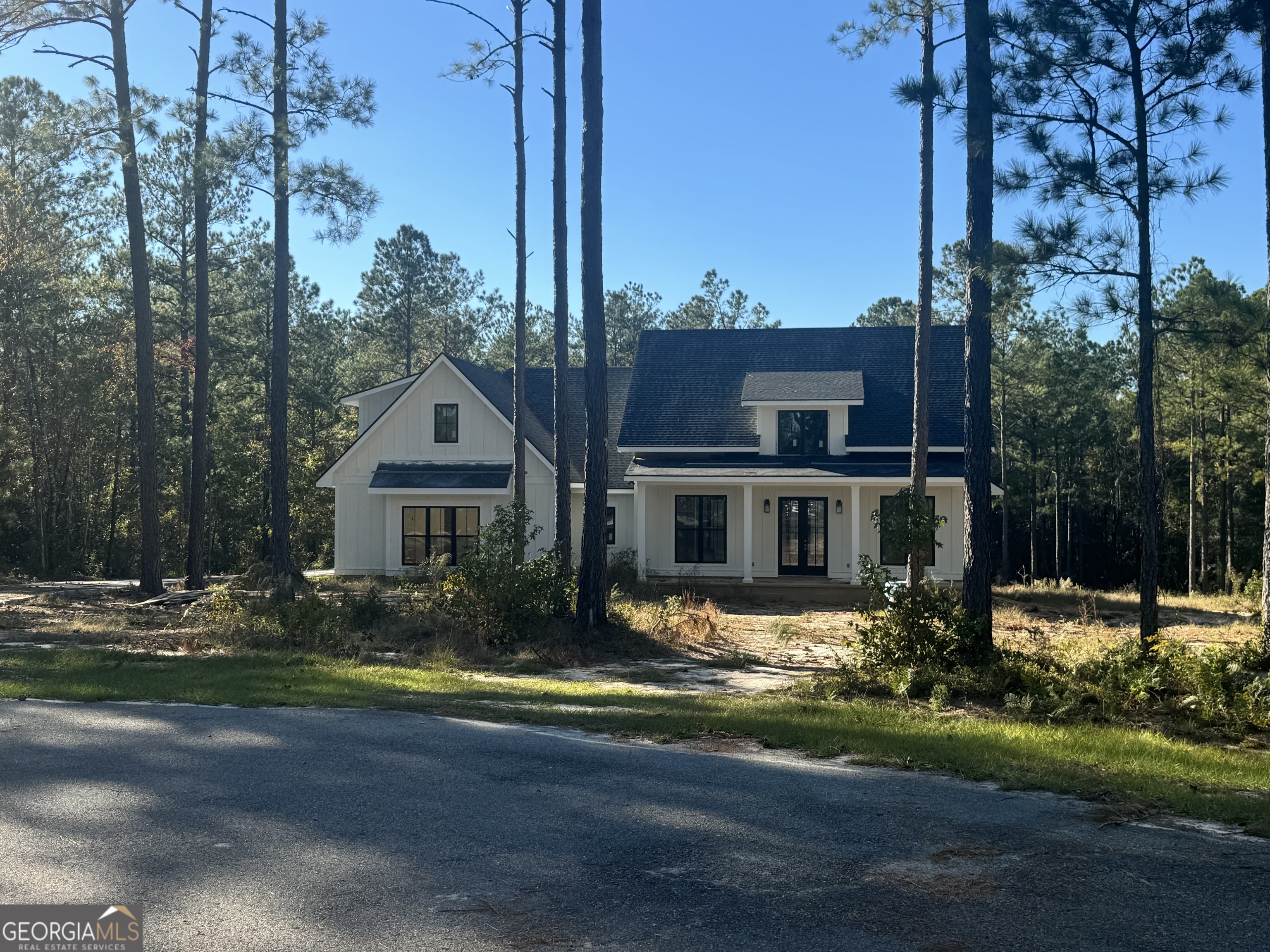 a view of house with outdoor space and swimming pool