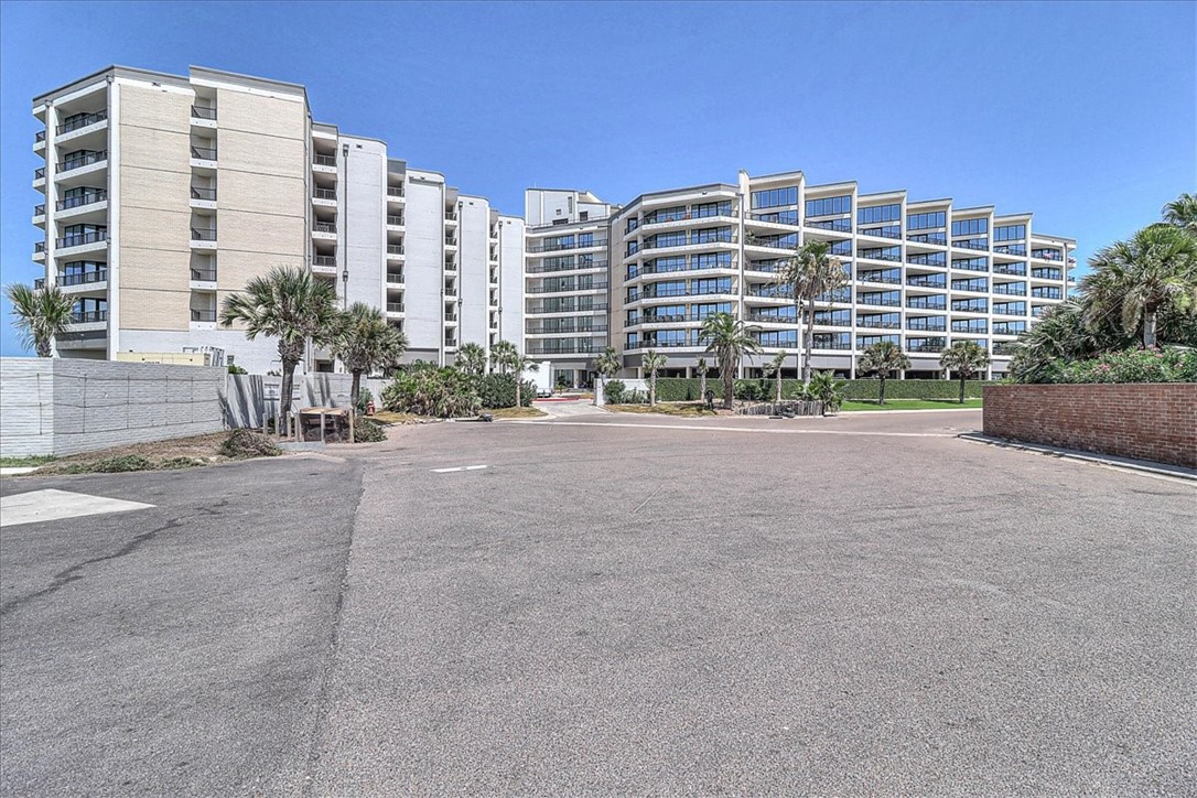 a front view of a building with a road