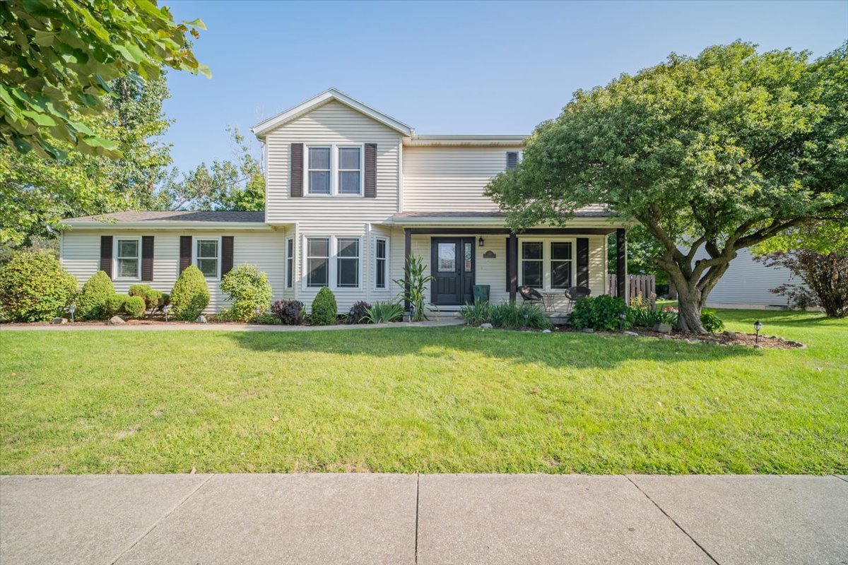 front view of a house with a yard