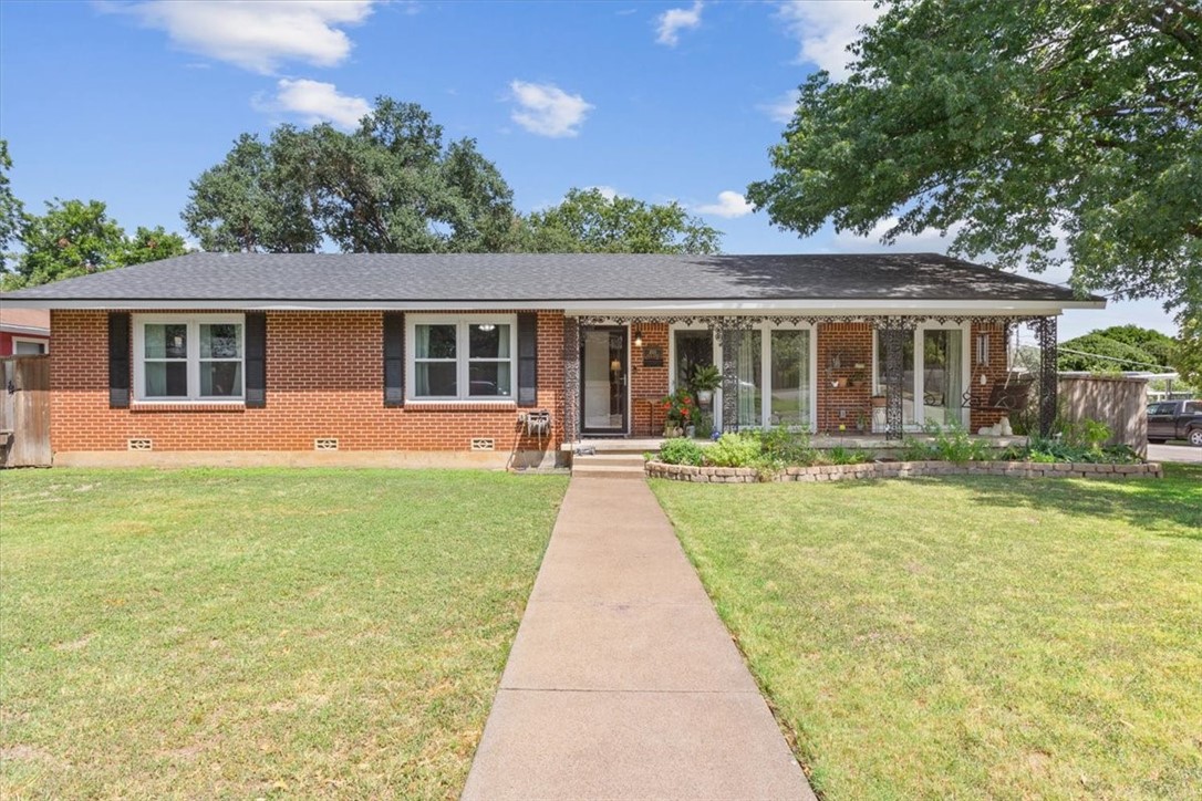 front view of a house with a yard