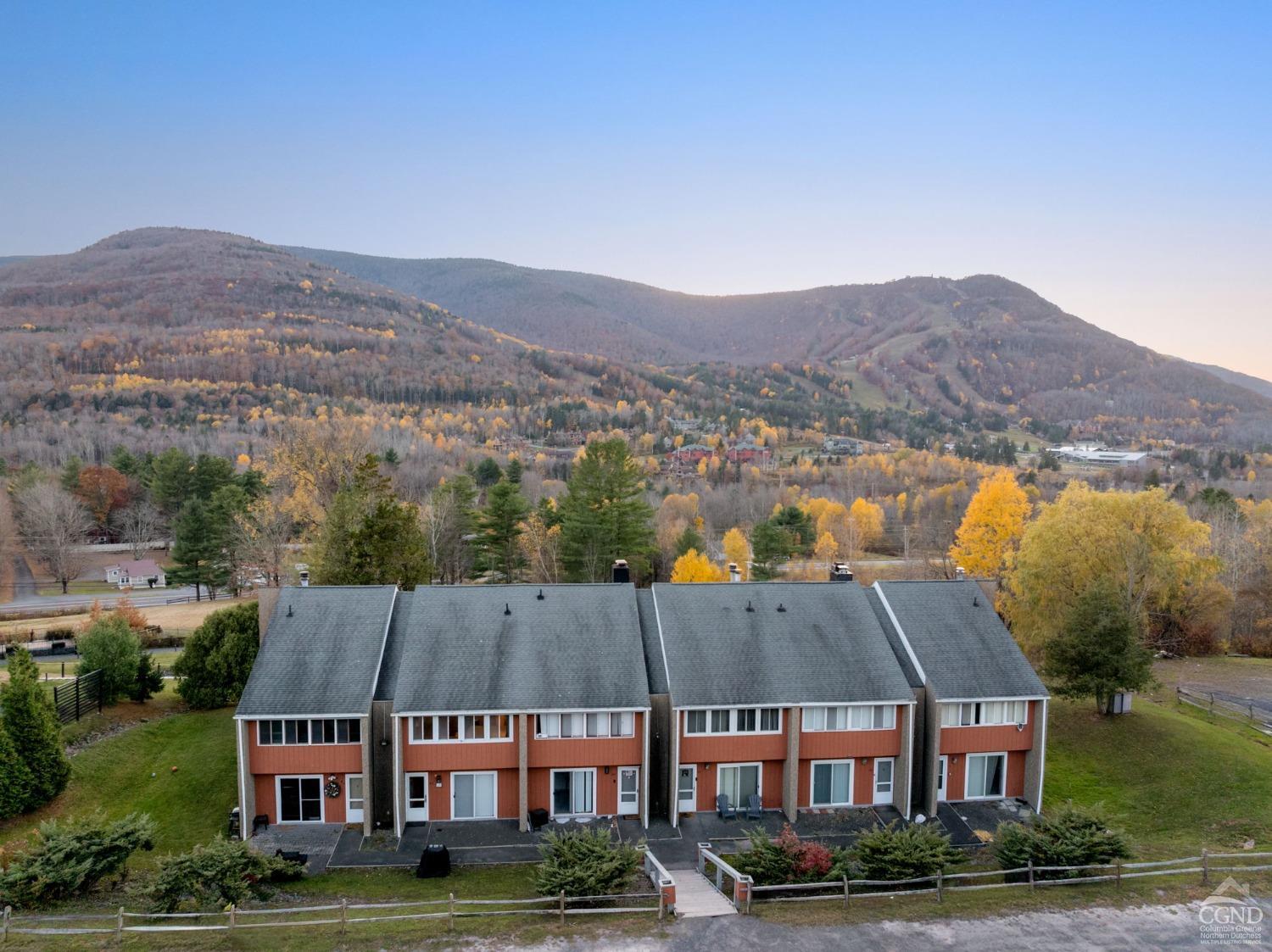 an aerial view of residential houses and outdoor space