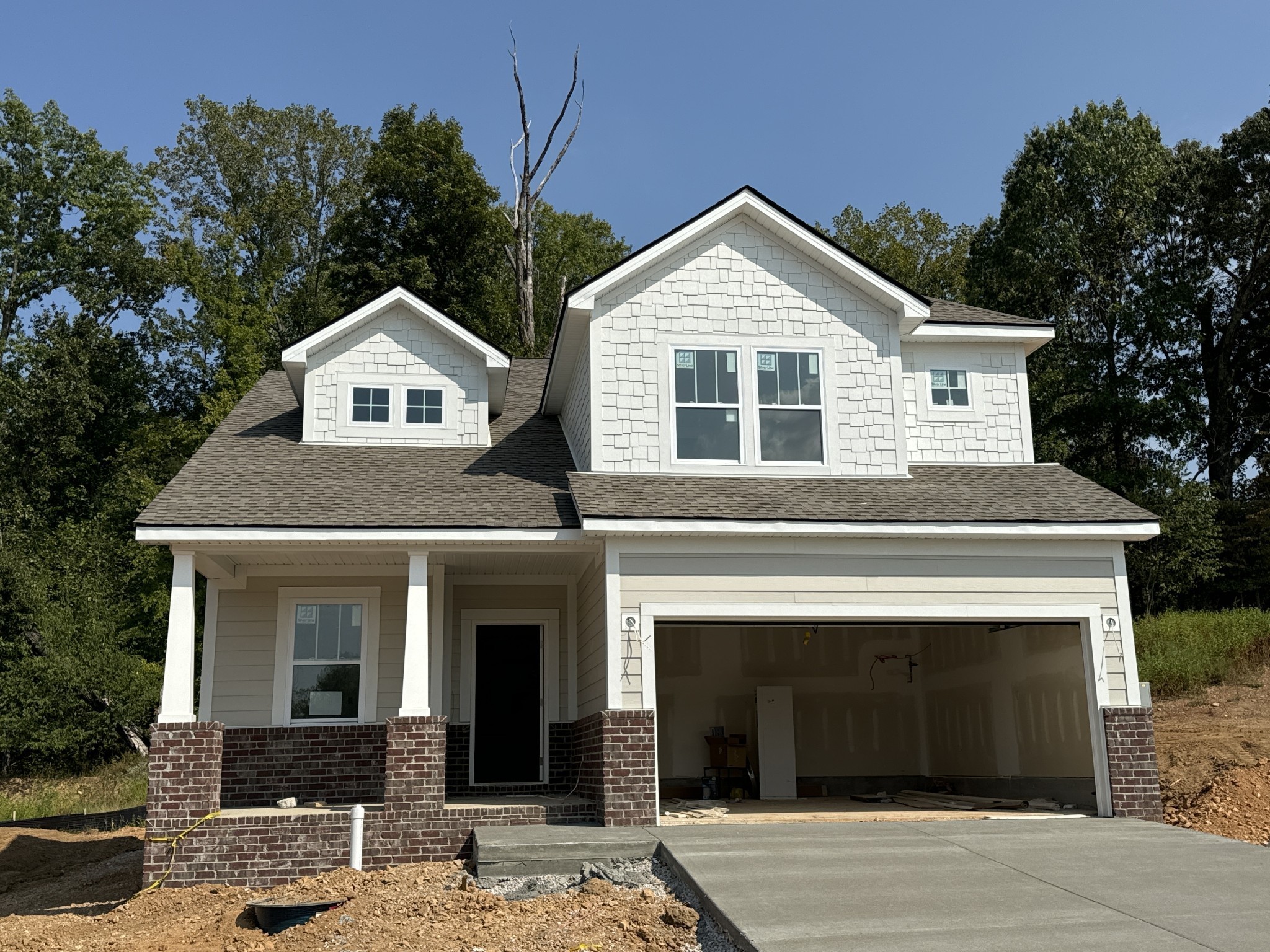 a front view of a house with yard