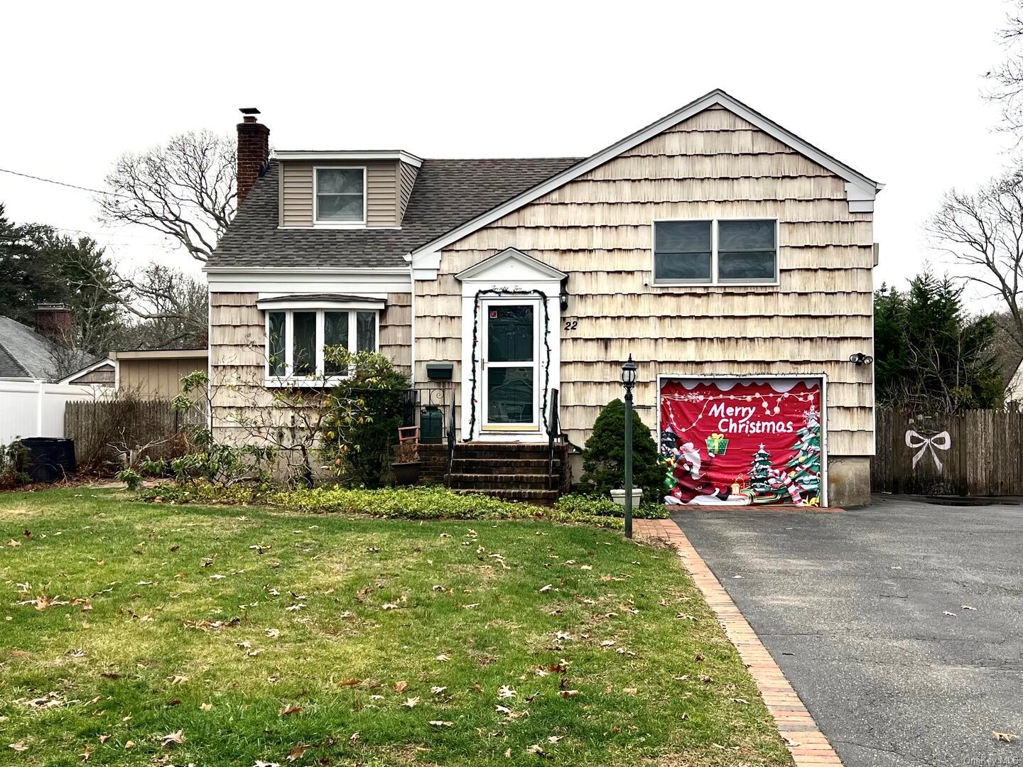 View of front of property with a front yard