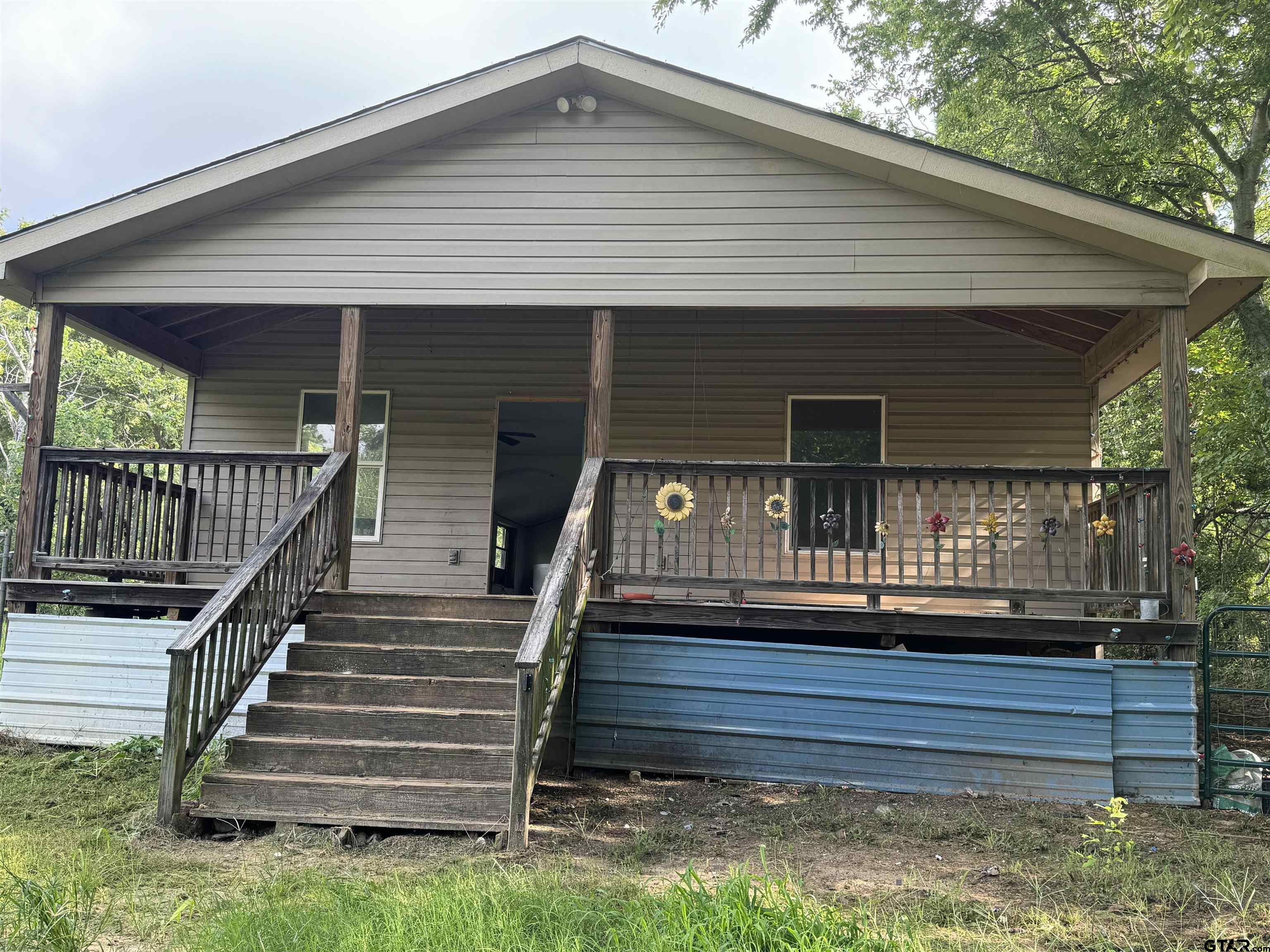 a front view of a house with a porch