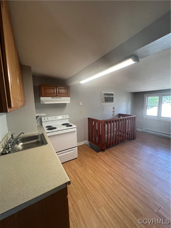 a kitchen with kitchen island granite countertop a sink cabinets and stainless steel appliances